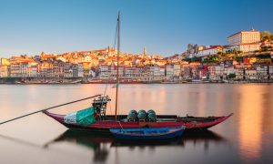 Team on a sunset boat cruise with Fado music in Lisbon