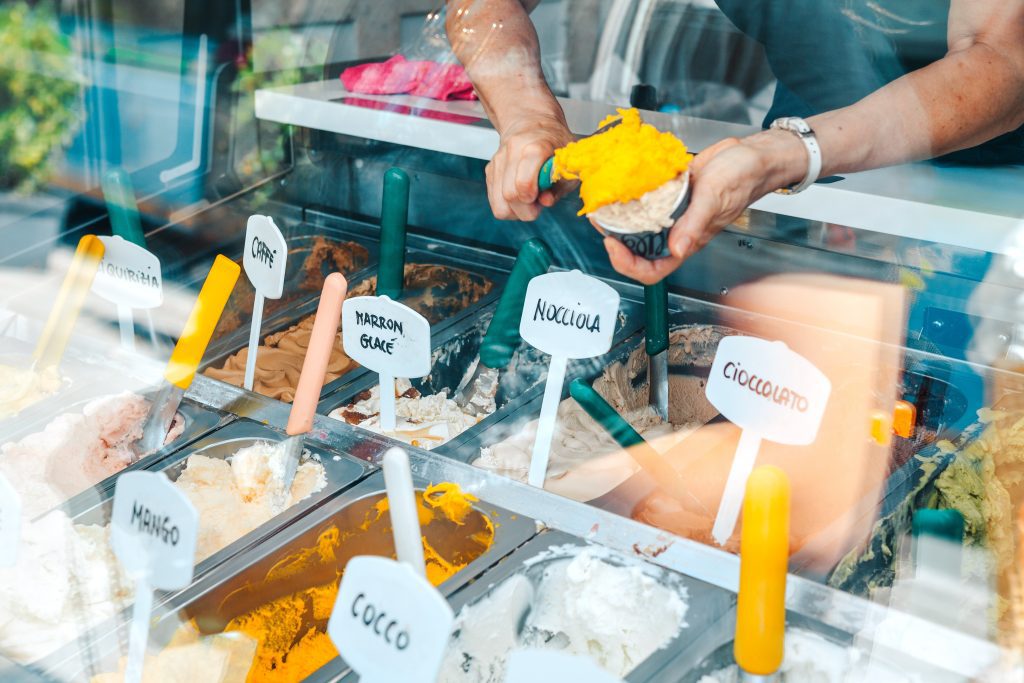 Woman having ice cream in an Italian ice cream shop