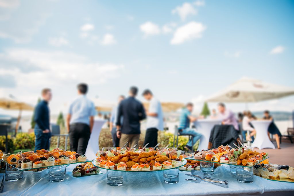 Aperitifs at a rooftop party with business people.