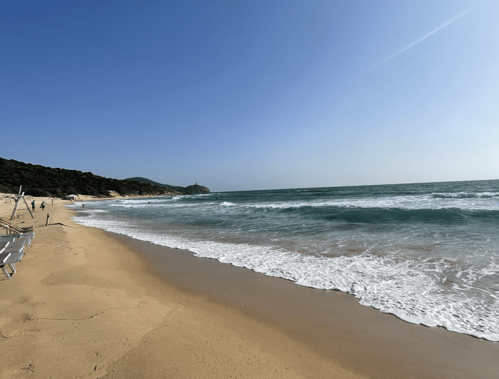 Sandy beach, sunny day and blue sky.