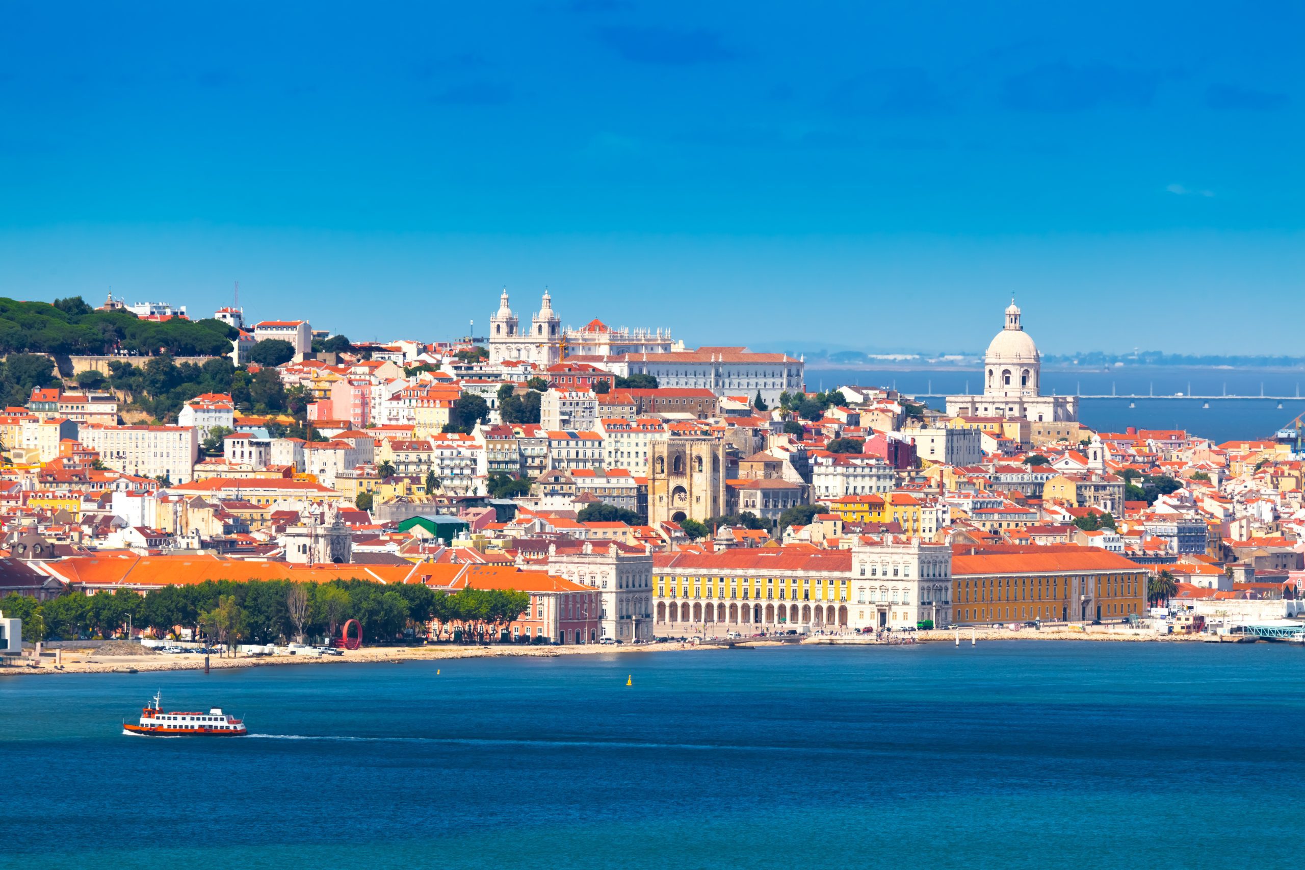 Catamaran excursion with your team in Lisbon, Portugal.