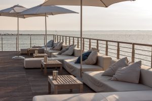 empty cafe terrace on sea side beach club