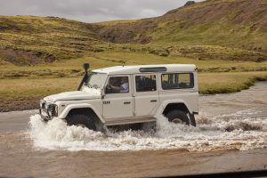 Offroad-Tour, car driving in a river.