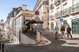 Lisbon streets, people walking. Sunny day.