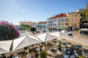 City center Lisbon, people sitting outside in a restaurant, sunny day.