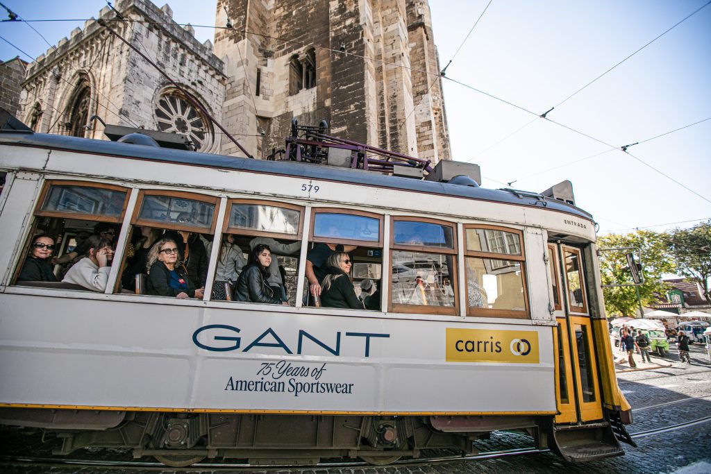 Tourist in tramway driving through the city of Lisbon.