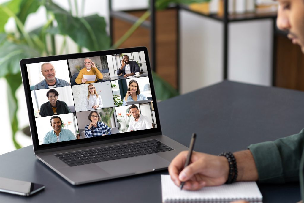Zoom Meeting, laptop on the table, remote jobs.