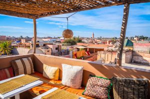Traditional Riad with view over Marrakesh, colorful Interior.