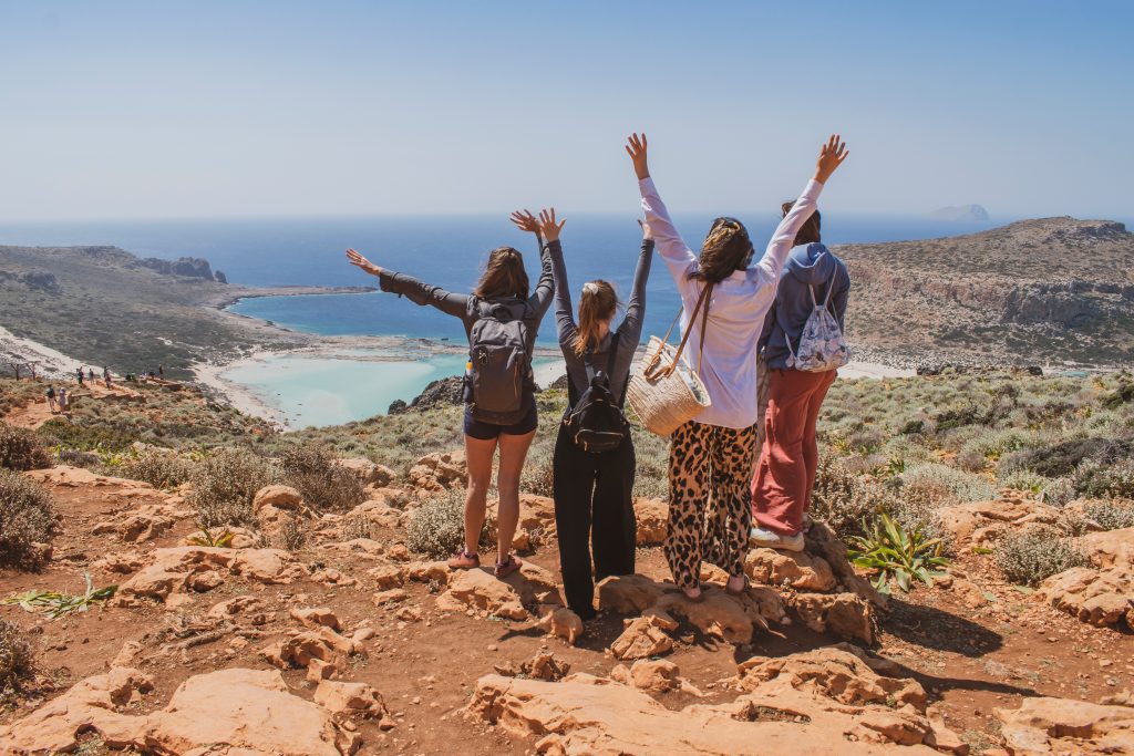 Group of Friends at Balos Lagoon in Crete, Greece.