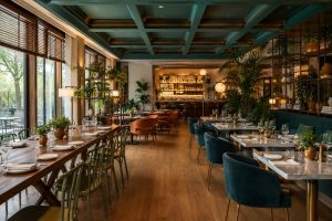 Elegant hotel restaurant arranged for group dining in Milan