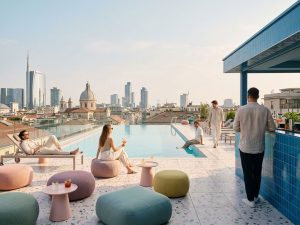 Rooftop pool and lounge area at a Milan hotel for dynamic teams
